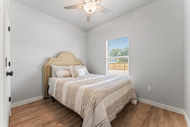 bedroom featuring hardwood / wood-style flooring and ceiling fan