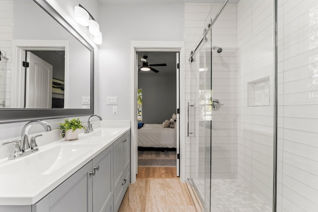 bathroom with an enclosed shower and vanity