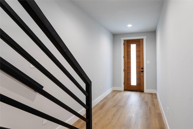 foyer entrance with light wood-type flooring