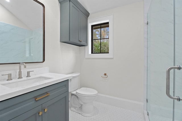 bathroom featuring vanity, tile patterned floors, a shower with door, and toilet