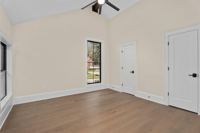 unfurnished bedroom featuring vaulted ceiling with beams, wood-type flooring, and ceiling fan