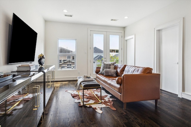 living room with french doors and dark hardwood / wood-style floors