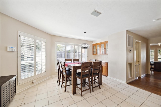 dining area featuring a wealth of natural light and light tile patterned floors