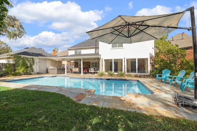 view of pool featuring a patio