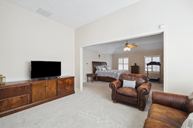 carpeted bedroom with lofted ceiling and ceiling fan