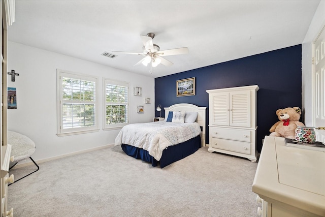 carpeted bedroom with ceiling fan