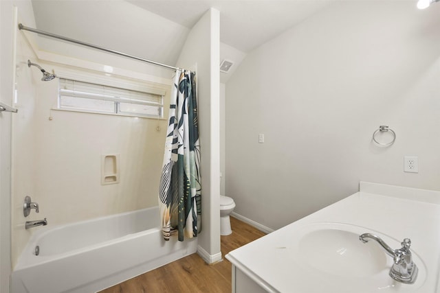 full bathroom with shower / bath combination with curtain, vanity, toilet, and hardwood / wood-style flooring