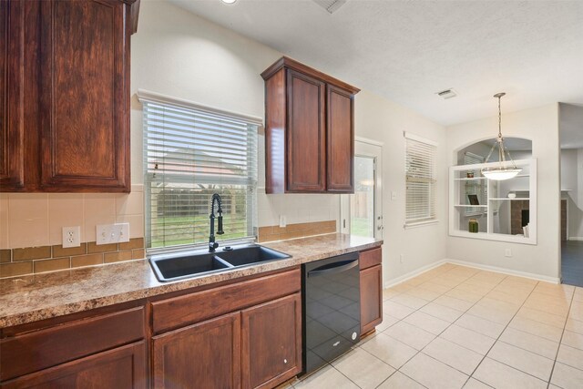 kitchen with black dishwasher, sink, decorative backsplash, hanging light fixtures, and light tile patterned floors