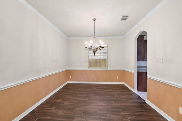 unfurnished dining area with a notable chandelier and ornamental molding