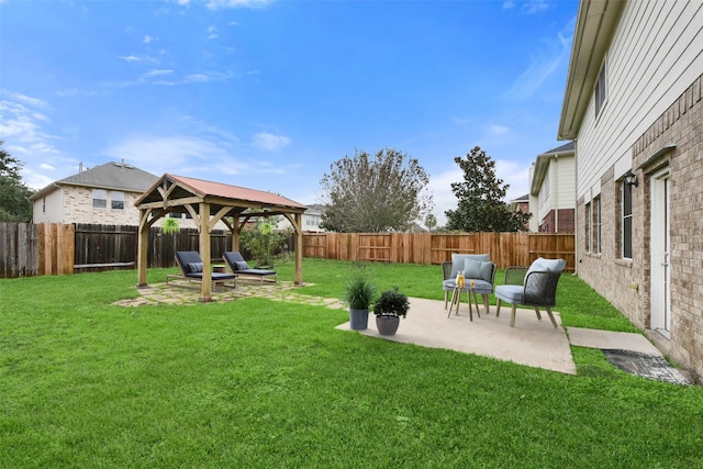 view of yard with a patio area, a fenced backyard, and a gazebo