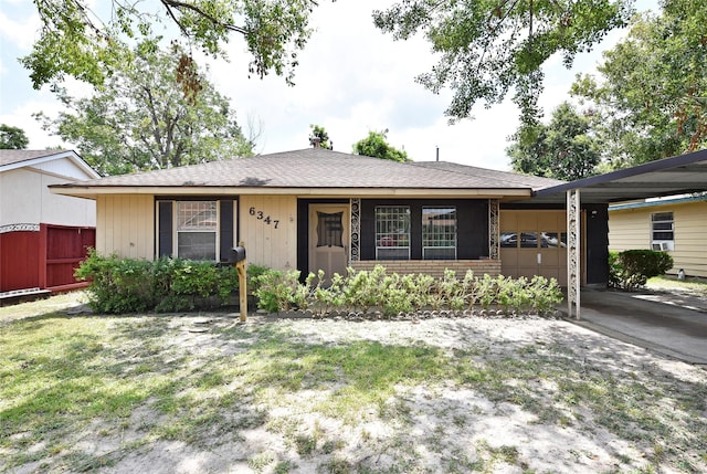 ranch-style house with a garage and a front yard