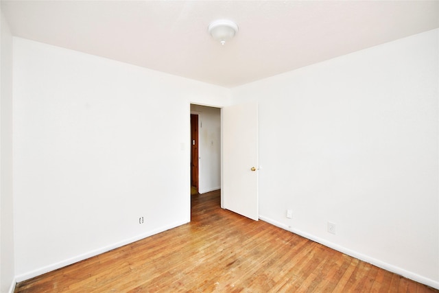 spare room featuring light hardwood / wood-style floors