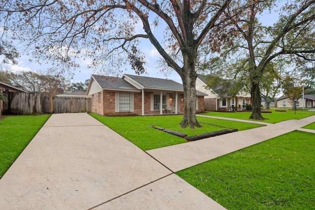 ranch-style home with a front yard