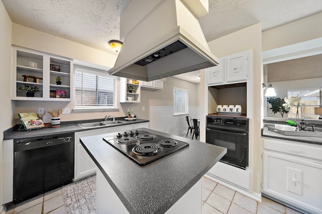 kitchen featuring range hood, sink, white cabinets, black appliances, and a textured ceiling