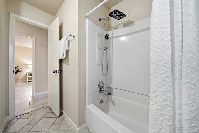 bathroom featuring tile patterned floors, a textured ceiling, and shower / bath combo