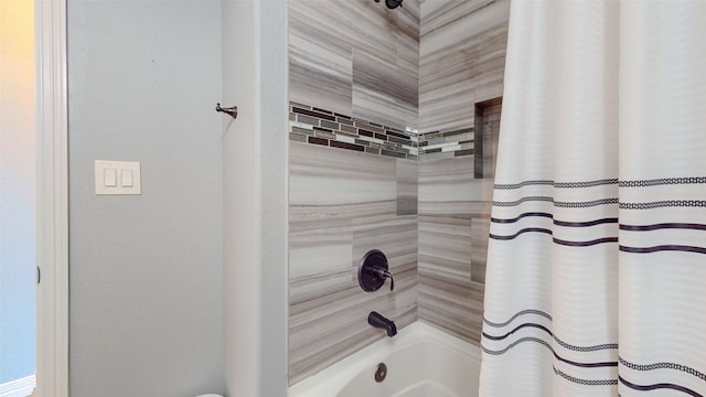 bathroom with shower / bath combo