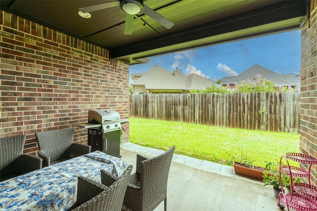 view of patio with grilling area and ceiling fan