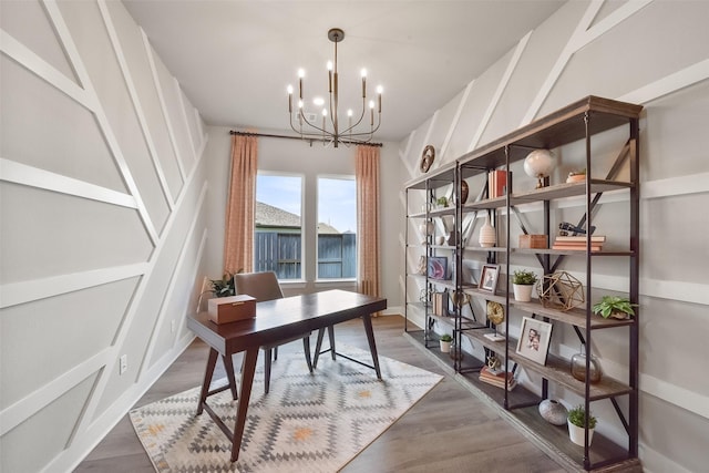 office space with an inviting chandelier and dark hardwood / wood-style floors