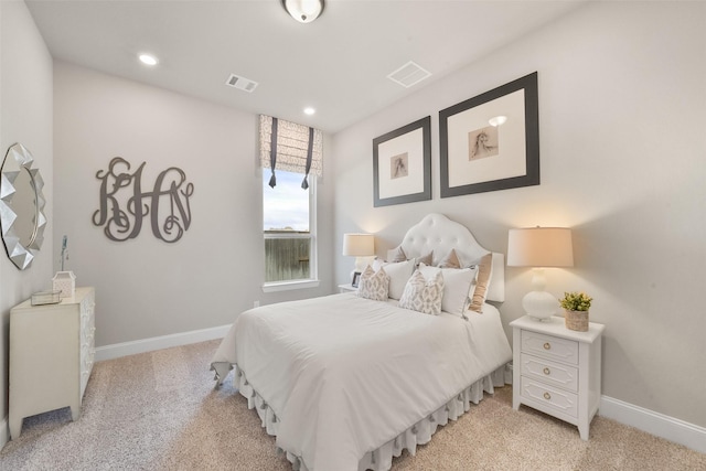 bedroom featuring light carpet