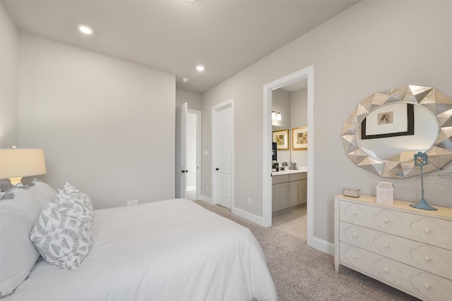 carpeted bedroom with ensuite bathroom