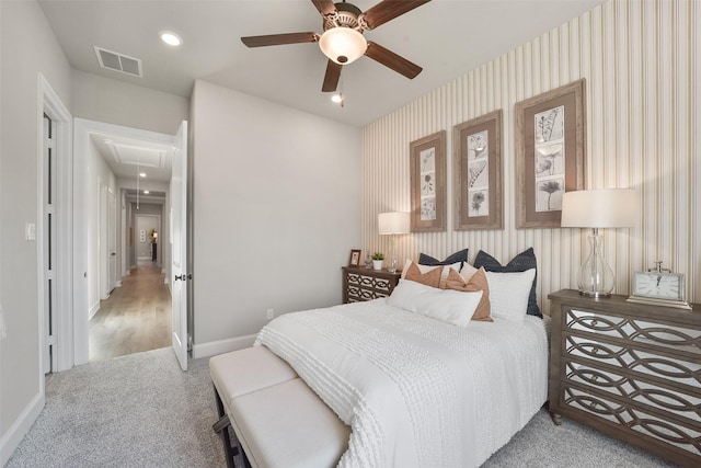 carpeted bedroom with ceiling fan