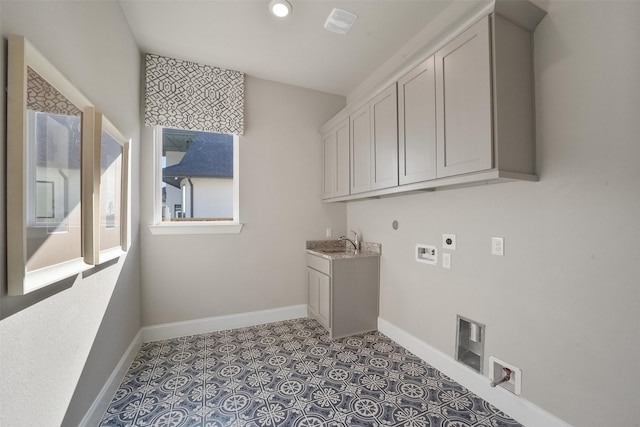 washroom featuring sink, cabinets, light tile patterned floors, hookup for a washing machine, and electric dryer hookup