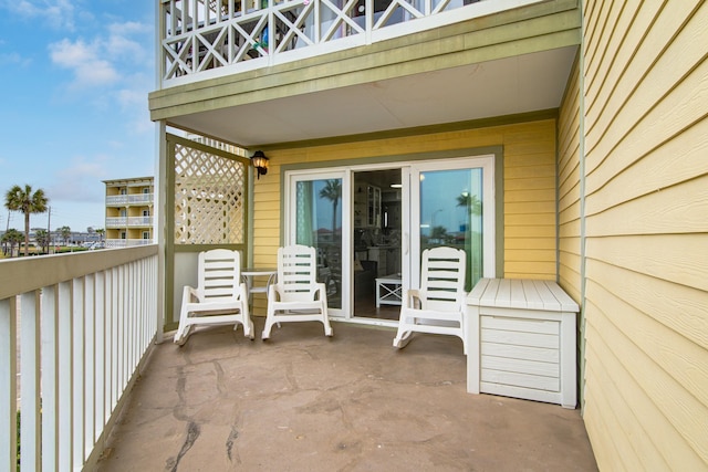 view of patio featuring a balcony