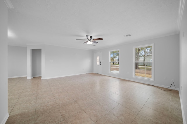 tiled empty room featuring crown molding, a textured ceiling, and ceiling fan