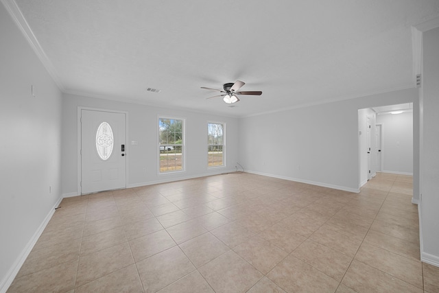 interior space featuring ceiling fan, ornamental molding, and light tile patterned floors