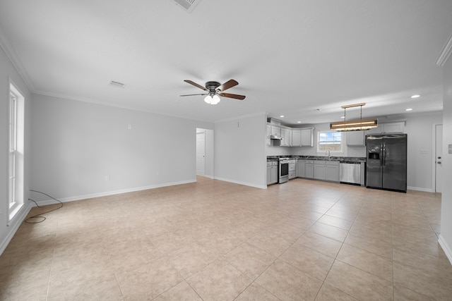 unfurnished living room featuring sink, ornamental molding, ceiling fan, and light tile patterned flooring