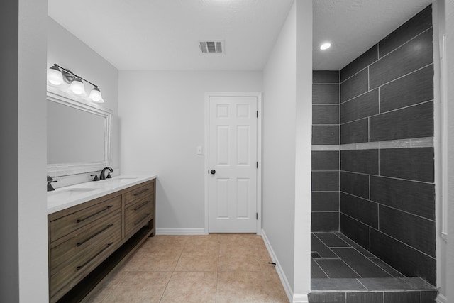 bathroom with vanity and tile patterned floors