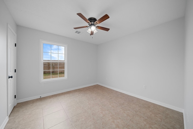 unfurnished room featuring ceiling fan and light tile patterned floors