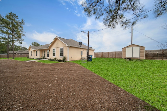 view of property exterior featuring a yard and a storage unit