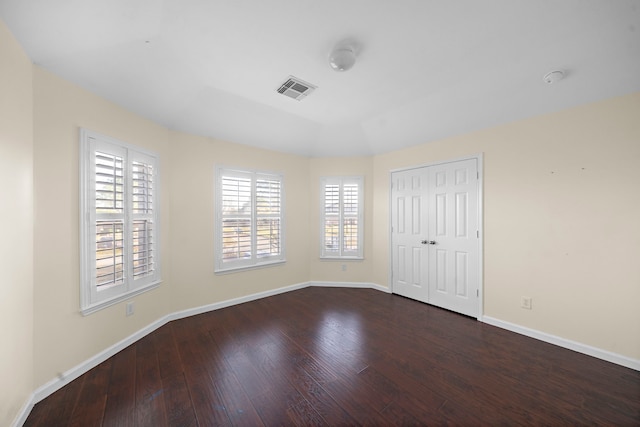 unfurnished room with dark hardwood / wood-style floors