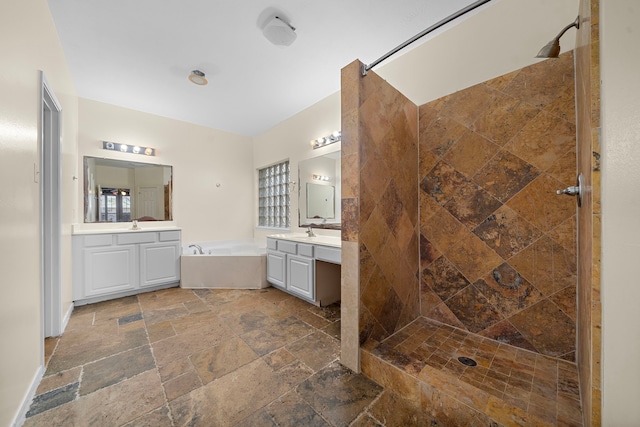 bathroom with shower with separate bathtub and vanity