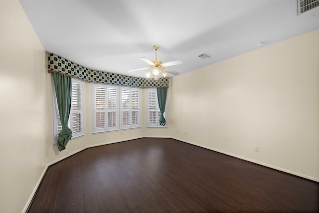 spare room with hardwood / wood-style flooring and ceiling fan