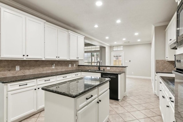 kitchen featuring white cabinetry, a center island, sink, and black appliances