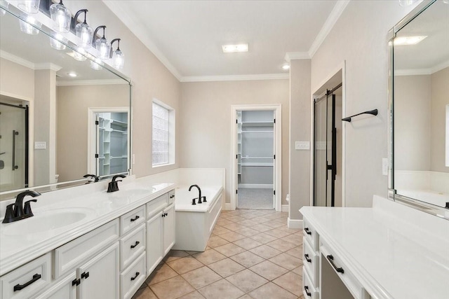 bathroom featuring crown molding, tile patterned floors, and vanity