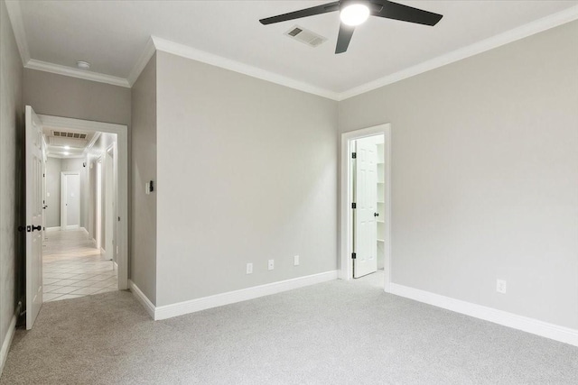 carpeted empty room with crown molding and ceiling fan