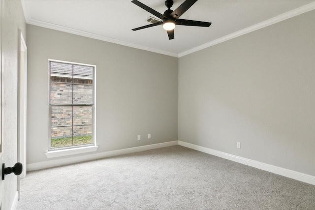 empty room featuring ornamental molding, light colored carpet, and ceiling fan