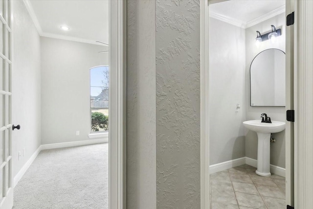 bathroom with tile patterned floors and ornamental molding