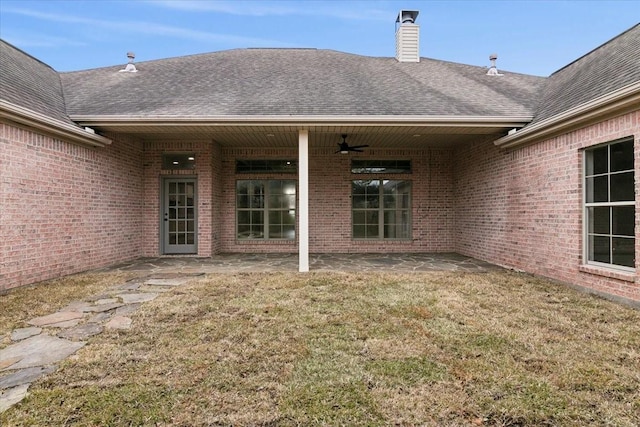 exterior space with a patio area, ceiling fan, and a lawn