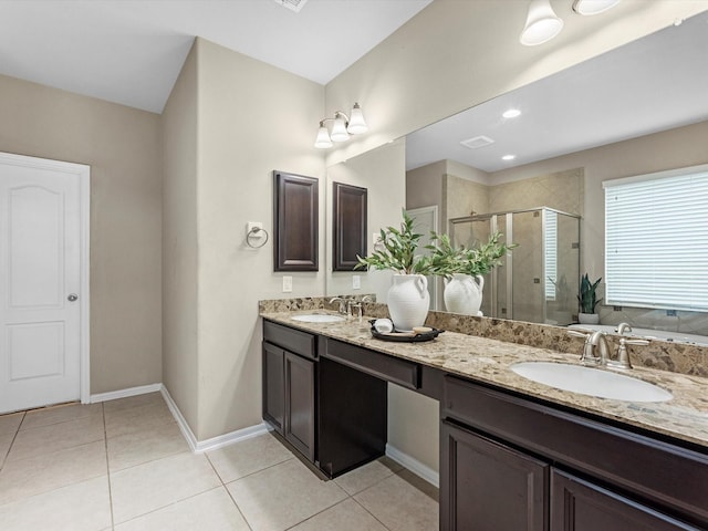 bathroom with vanity, tile patterned floors, and a shower with shower door