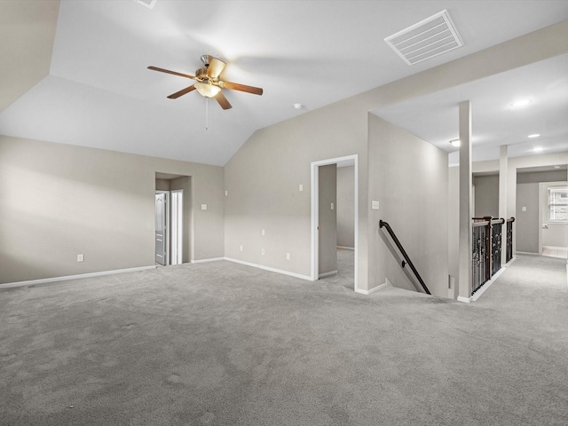 unfurnished room featuring lofted ceiling, light carpet, and ceiling fan