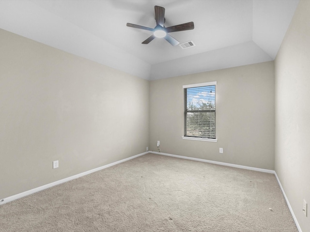 unfurnished room featuring ceiling fan, lofted ceiling, and carpet flooring