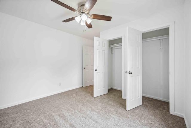 unfurnished bedroom with ceiling fan, light colored carpet, and a closet