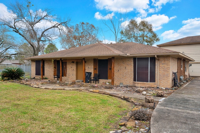 view of front facade with a garage and a front yard