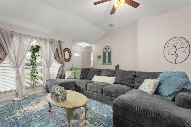 living room featuring vaulted ceiling and ceiling fan