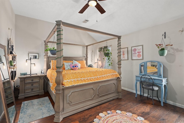 bedroom with vaulted ceiling, dark hardwood / wood-style floors, and ceiling fan