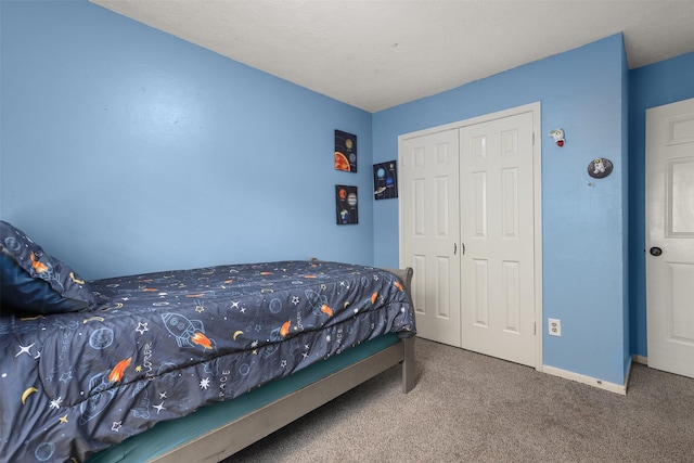 carpeted bedroom featuring a closet